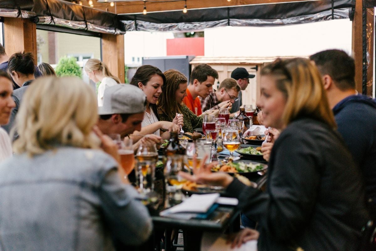 People sitting around a table in a restaurant