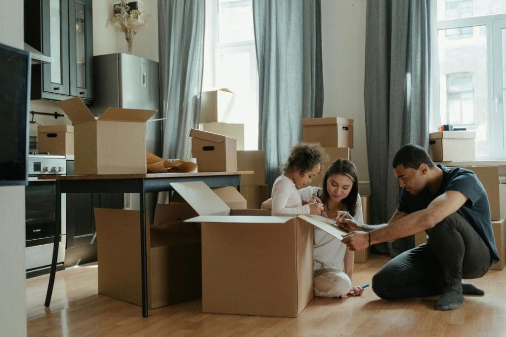 Family packing their belongings into boxes