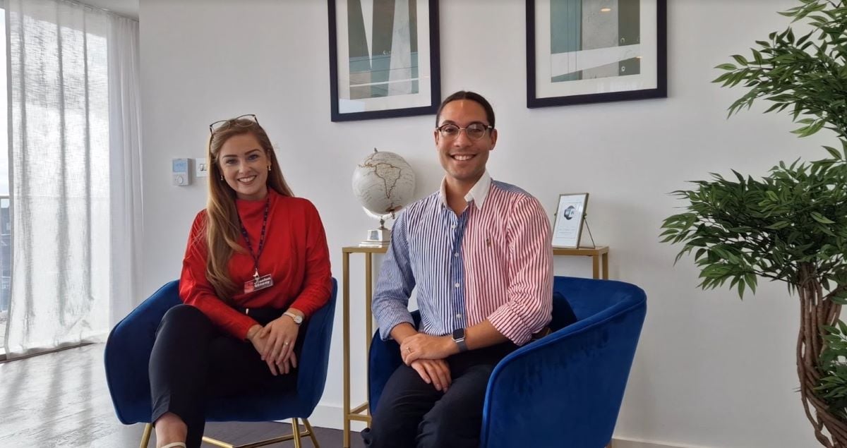 Two people sat on chairs