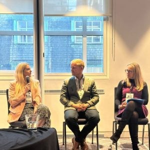 panel of three professionals in discussion